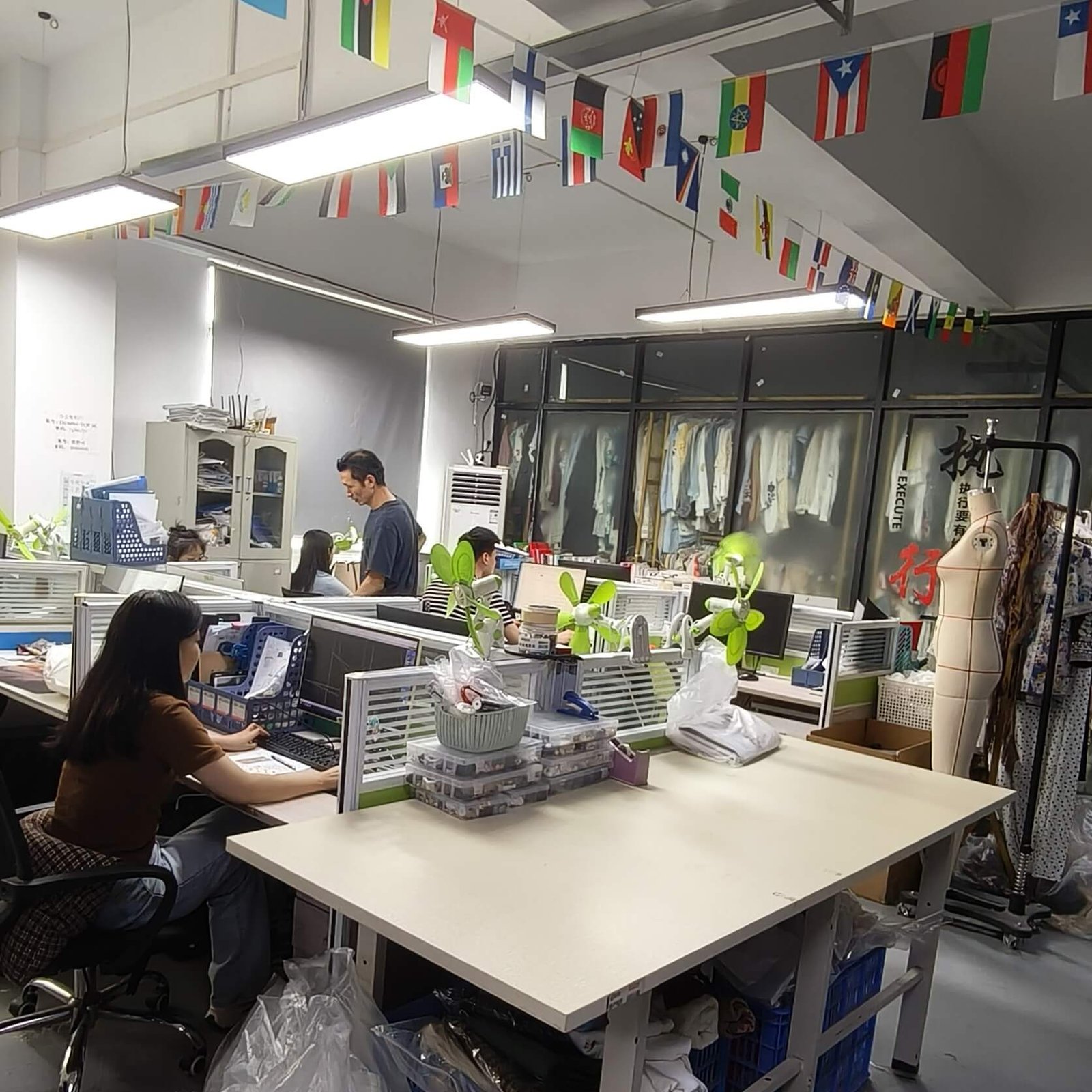 In-house pattern-making and development team at our Guangzhou womenswear factory.