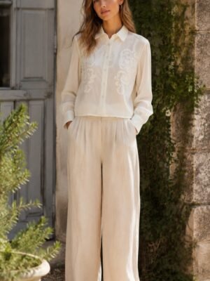 Tonal Scroll Cropped Blouse in ivory white. Lifestyle model shot showcasing the fit and drape. B2B wholesale Blouses & Tops SKU: AM25382.