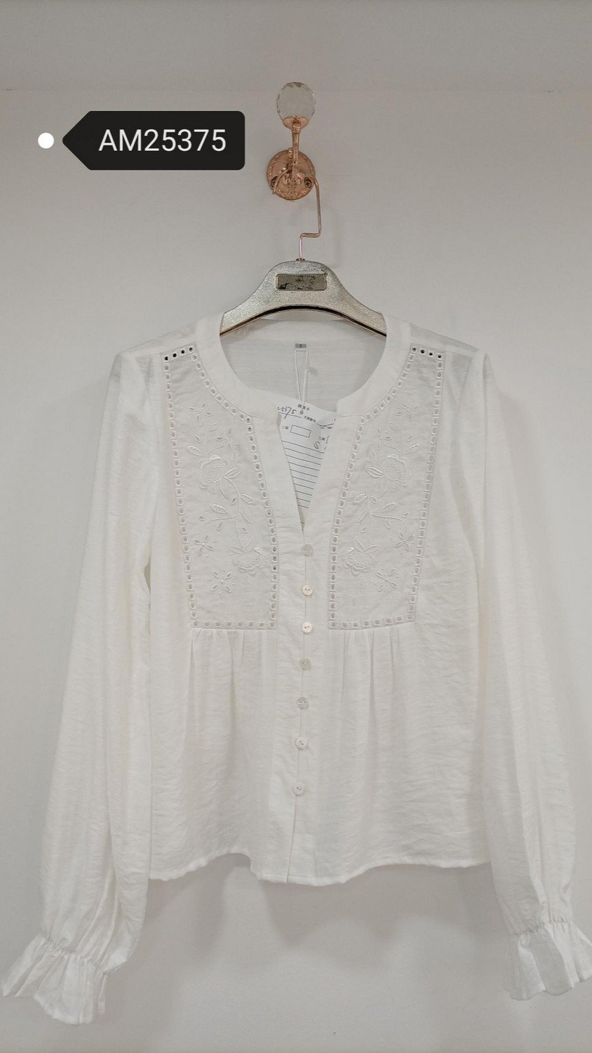 White Floral Panel Gathered Blouse in white. Detailed front flat lay view highlighting the overall silhouette. B2B wholesale Blouses & Tops SKU: AM25375.